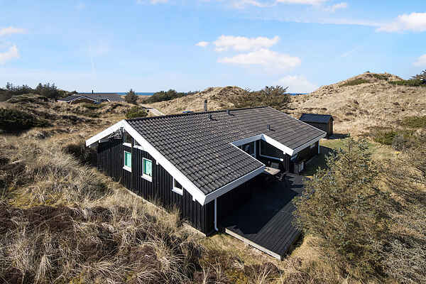 Sommerhus med havutsikt i sanddynene