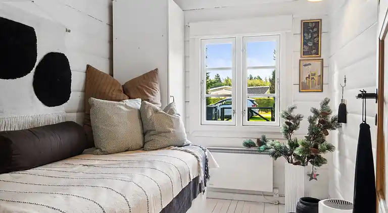 Charmerende bjælkehus tæt på vandet