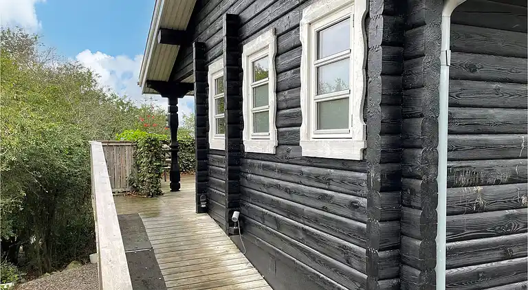 Hyggeligt bjælkehus med panoramaudsigt