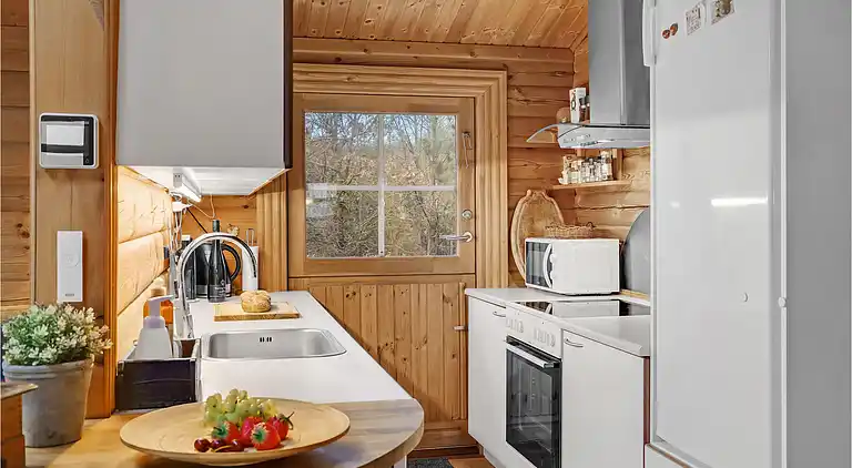 Hyggeligt bjælkehus med panoramaudsigt