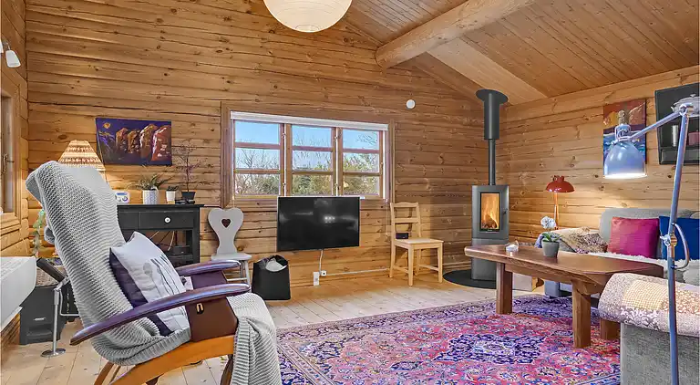 Hyggeligt bjælkehus med panoramaudsigt