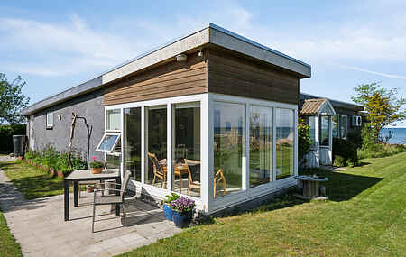 Holiday home with private beach and sea view