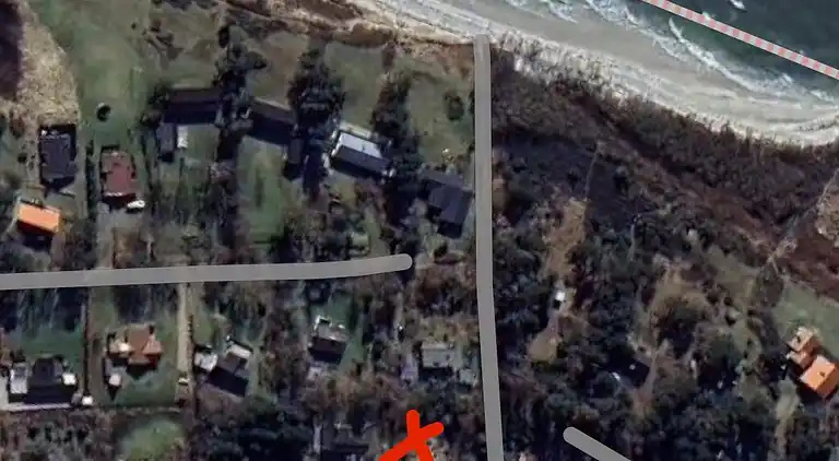 Lovely beach home enveloped in green surroundings