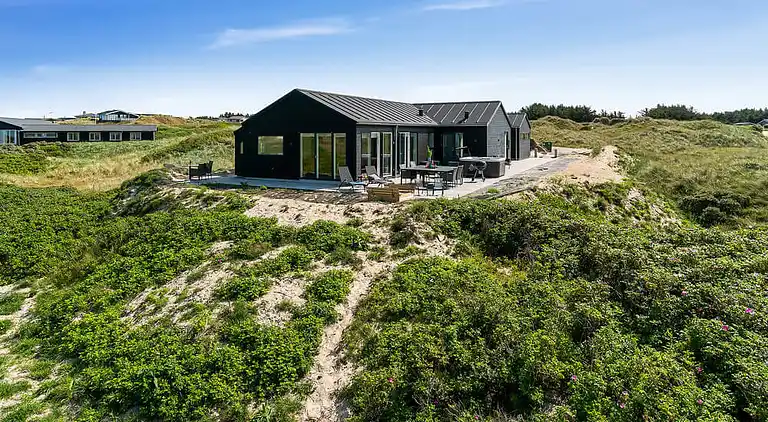 Luxus-Ferienhaus am Strand mit Spa & Spiel